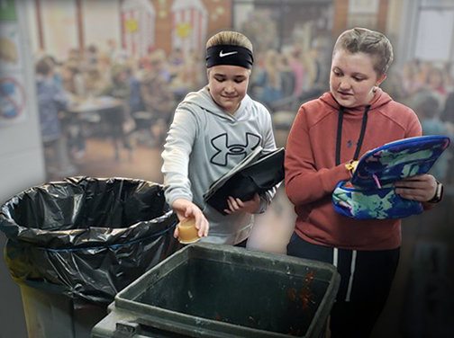 Ray Miller Elementary students sort compostable food scraps during their lunch period. Working with the Truman Compost Project, the school is able to reduce food waste and reuse materials in its Outdoor Garden Classroom.