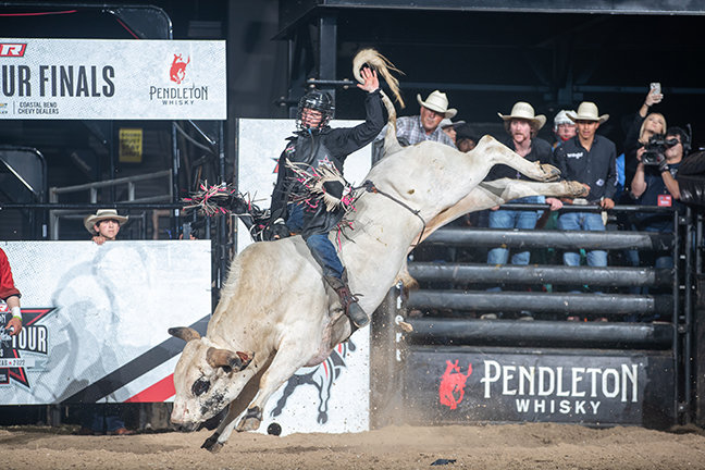 Casey Coulter attempts to ride&nbsp; I'm No Angel&nbsp; of&nbsp; Cooper/ Scruggs Bucking Bulls during the Round 1 of the PBR Pendleton Whisky Velocity Tour Finals event in Corpus Christi, TX. Photo by Andre Silva