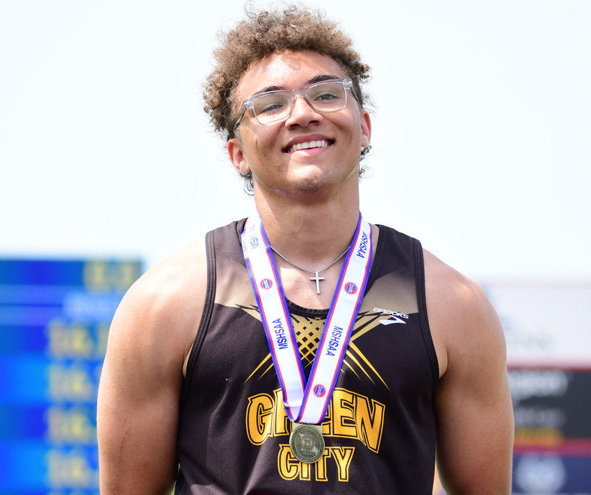 Green City's Asher Buggs-Tipton stands on the podium after winning the Class 1 boys long jump state title on Friday, May 20, 2022.