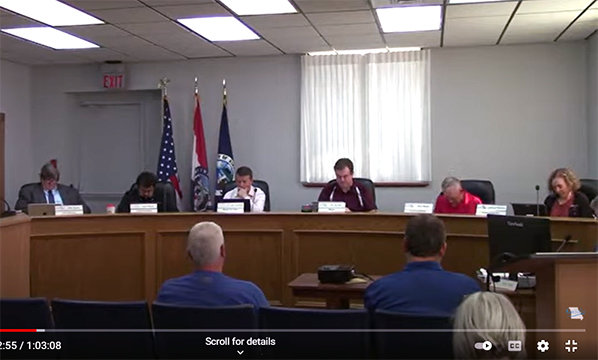 Kirksville City Council members take a moment of silence prior to the start of a recent meeting.