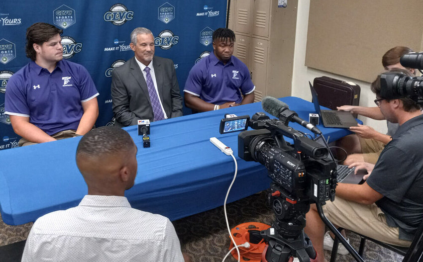 Truman State (from left) offensive lineman Justin Watson, head coach Gregg Nesbitt and linebacker Ulysses Ross speak with media on Friday, July 29, as part of the GLVC Football Kickoff event held at McKendree University in Lebanon, Illinois. The Bulldogs were recently picked to finish second in the conference in a preseason poll.&nbsp;
