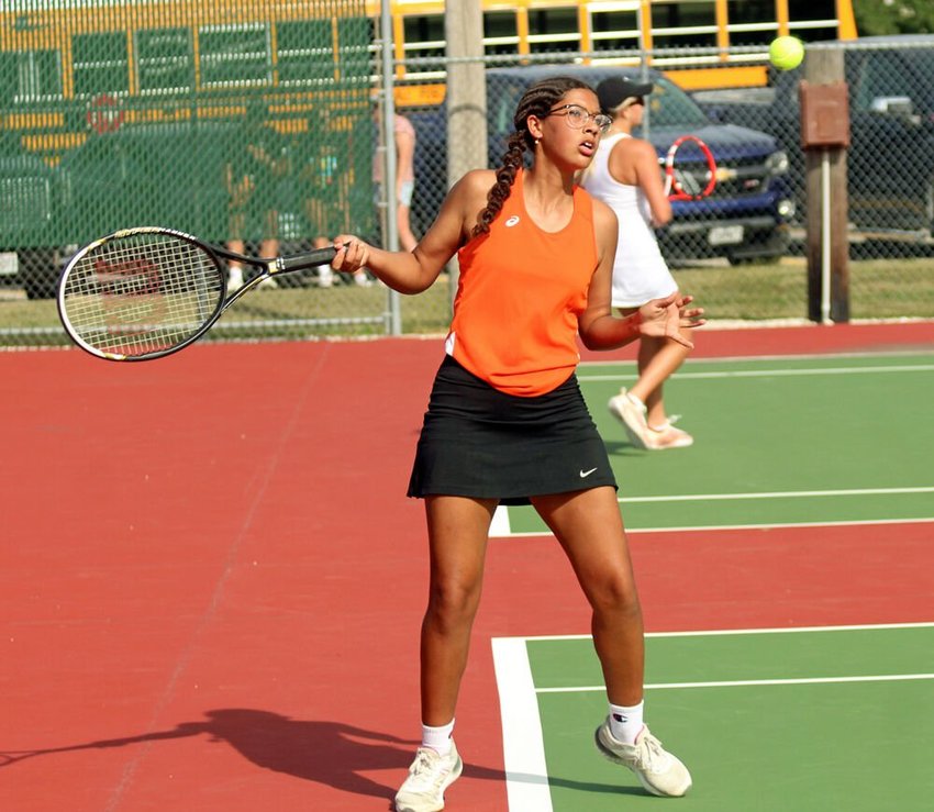 Kirksville junior Katlynn DeLeon steps back to receive a serve in a doubles match against Marshall on Sept. 1.&nbsp;