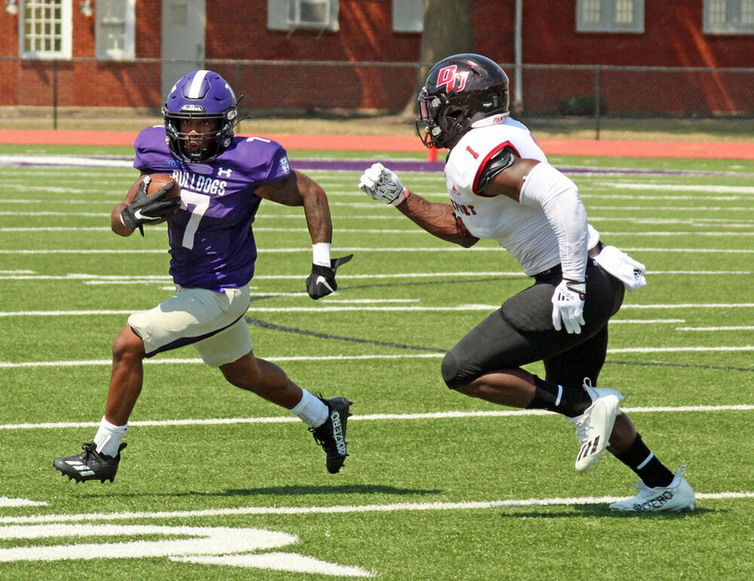 Truman State running back Shamar Griffith tries to run by a Davenport defender in the Bulldogs' game on Sept. 3 at Stokes Stadium. Griffith ran for 46 yards in the game, a 20-19 loss for Truman.&nbsp;
