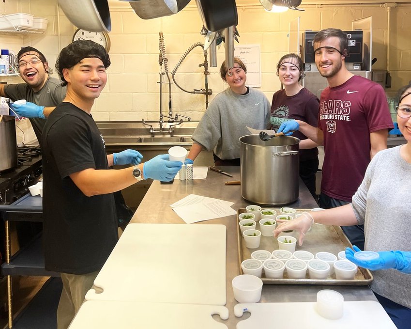 Students prepare meals for community members two Saturdays a month.&nbsp;