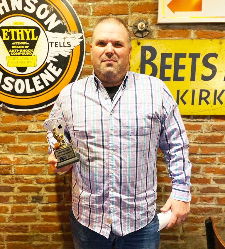 1st Place winner Phillip Carnes is shown holding his Texas Hold&rsquo;em Poker Trophy and check for $500.