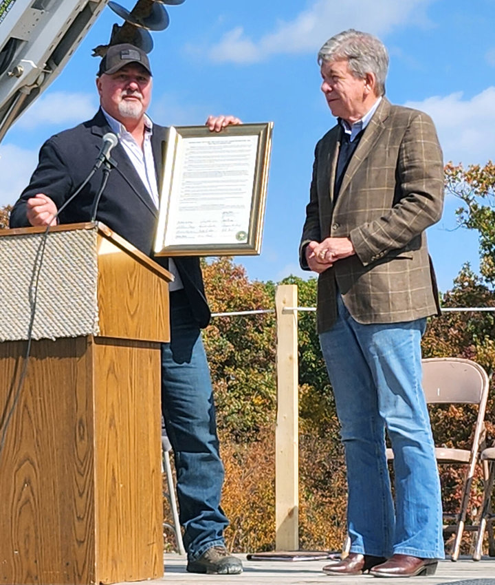 North Central Missouri Regional Water Commission General Manager Brad Scott presents Senator Roy Blunt with a framed copy of the Resolution naming the East Locust Creek Reservoir the Roy Blunt Reservoir.