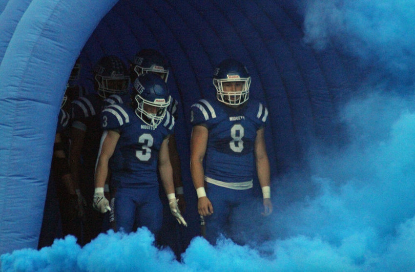 Putnam County football players Blaine Perkins (3) and Chase Tomlin (8) prepare to lead the team onto the field prior to the game against Trenton on Sept. 16. Putnam County would lose the game 42-20.&nbsp;