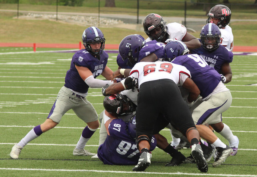 Truman State defenders swarm to tackle a Davenport ballcarrier in the season opener on Sept. 3.&nbsp;