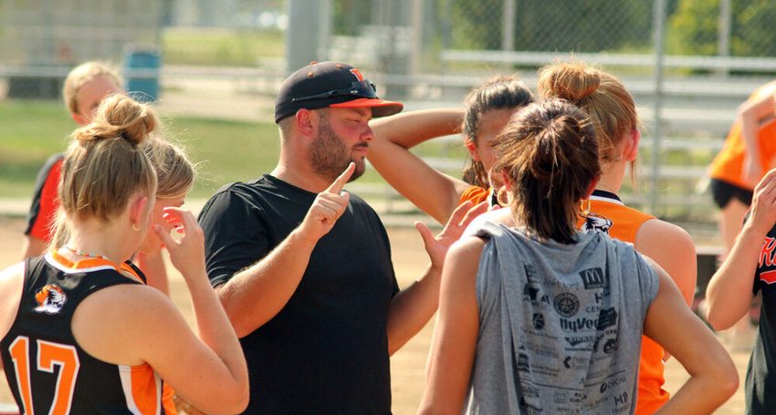Kirksville varsity softball head coach Derek Allen speaks with members of the team before batting practice on Aug. 25 at North Park. The Tigers begin the 2022 season Saturday at the Lady Pirate Leadoff Classic.&nbsp;