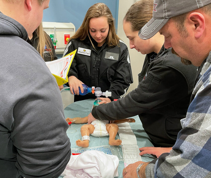 Adair County Ambulance first responders train on a baby mannequin inside the&nbsp;state-of-the-art mobile simulation unit provided by the University of Missouri School of Medicine and the University of Missouri Extension.&nbsp;
