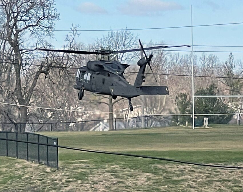 A Black Hawk helicopter lands in the field off of Halliburton and LaHarpe streets.&nbsp;