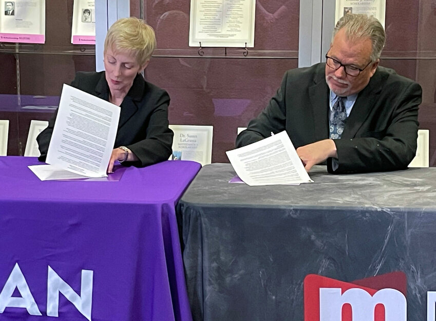 Truman State University President Sue Thomas and Moberly Area Community College President Jeff Lashley sign an MOU between the two schools, celebrating the schools' partnership in the DATA Science Pathway Initiative.&nbsp;