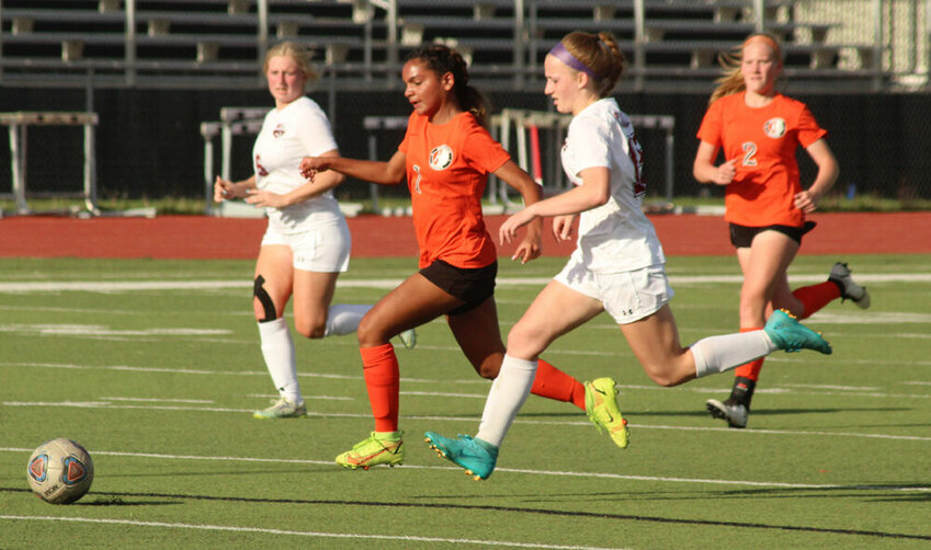 Kirksville sophomore Cambria Hart races a Canton defender to the ball in the game on May 4.&nbsp;