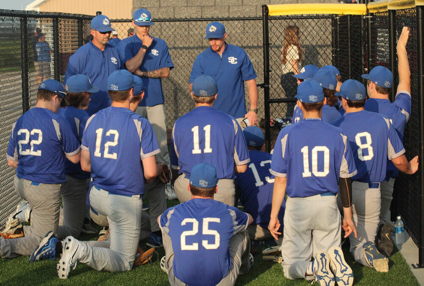 Scotland County head coach James Sears (center) talks to his team prior to the game against Milan on May 12.&nbsp;