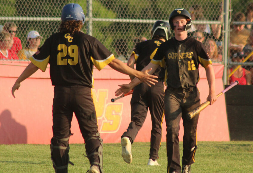 Green City's Grant O'Haver (29) and Kaden Johnson high five during the Gophers' sectional game against North Shelby on May 22.&nbsp;