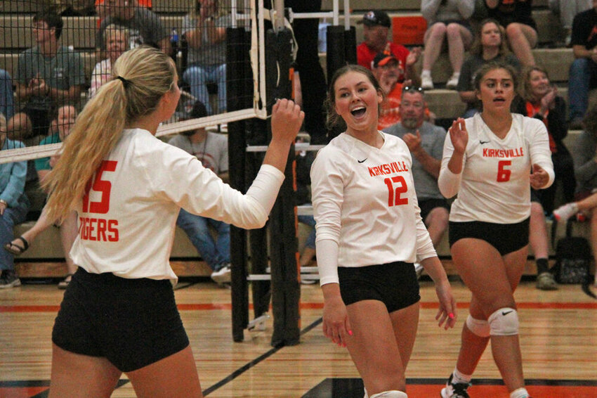 Kirksville players Ellen McNeely (12) and Lili Donjuan (6) celebrate a kill from Kynley Gresham (15) during the match against Mexico on Aug. 31.&nbsp;