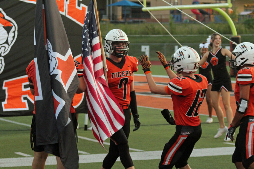 Kirksville senior Jack Thomas (7) prepares to lead the team through the banner prior to the game against Marshall on Sept. 22.&nbsp;