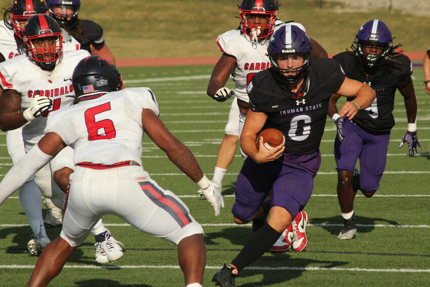 Truman quarterback Nolan Hair scrambles downfield in the game against Saginaw Valley State on Sept. 16.&nbsp;