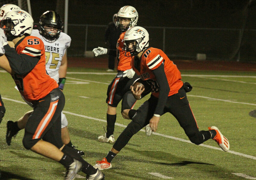 Kirksville quarterback Ryder Lyons runs behind blockers in the game against Excelsior Springs on Oct. 27.&nbsp;