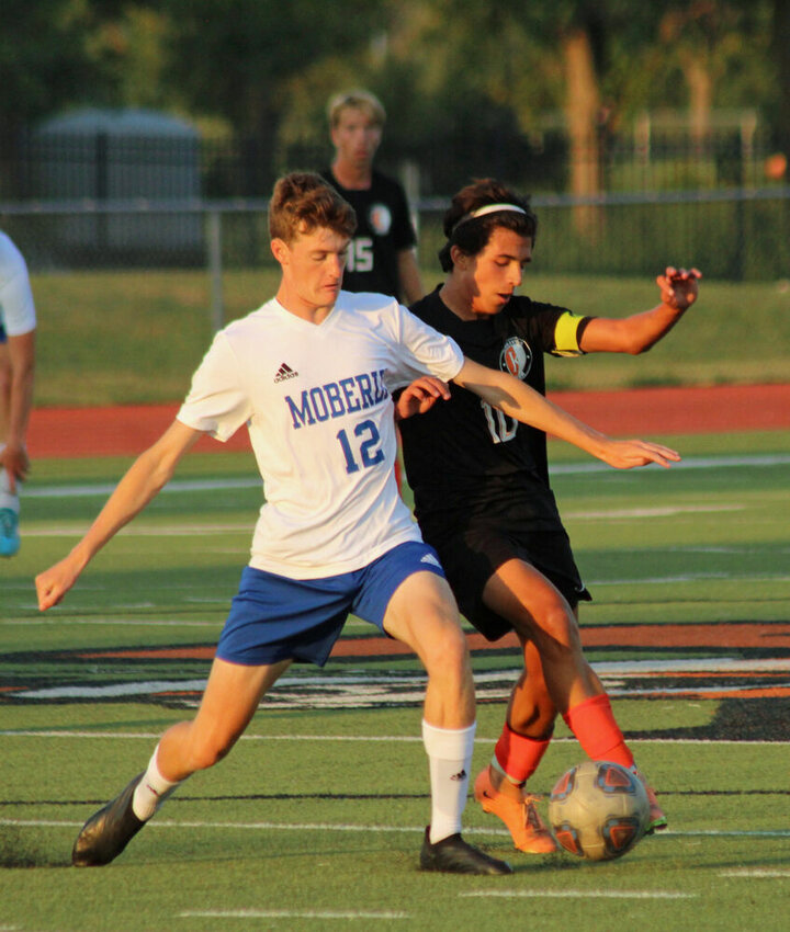Kirksville senior Will Tiedemann fights for possession of the ball during the match against Moberly on Sept. 7.&nbsp;