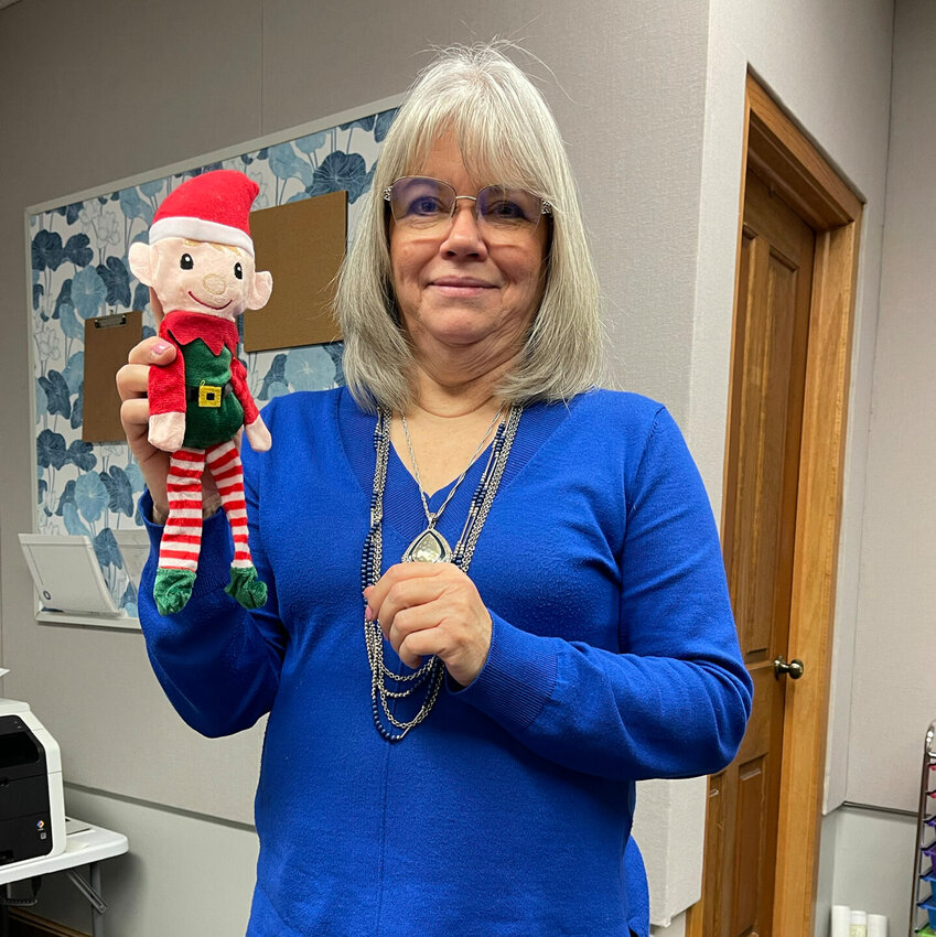 Kirksville Area Chamber of Commerce Director Marie Murphree holds and elf, one of many that will be placed in local businesses during the holiday season.&nbsp;