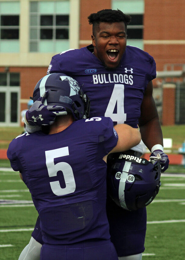 Truman linebacker Ulysses Ross (4) and defensive Kendall Hutchison (5) celebrate Ross' forced fumble in the game against Upper Iowa on Nov. 4.&nbsp;