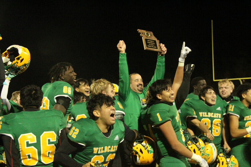 The Milan football team celebrates its district title after beating Penney on Nov. 17.&nbsp;
