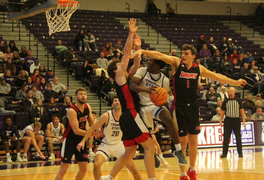 Truman guard Xavier looks to finish a layup through contact in the game against Drury on Jan. 20.&nbsp;