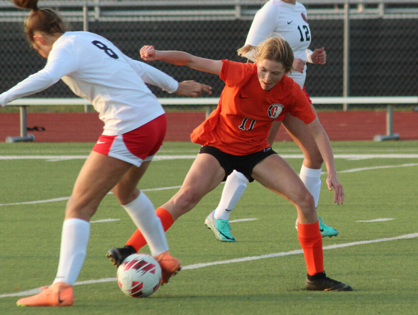 Kirksville freshman Emberlyn Pinson battles a Hannibal player for possession in the game on March 21.&nbsp;