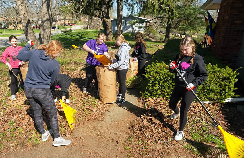Truman students rake leaves for a Kirksville resident on Saturday. More than 150 students volunteered at 84 community sites as part of the Big Event annual service project.