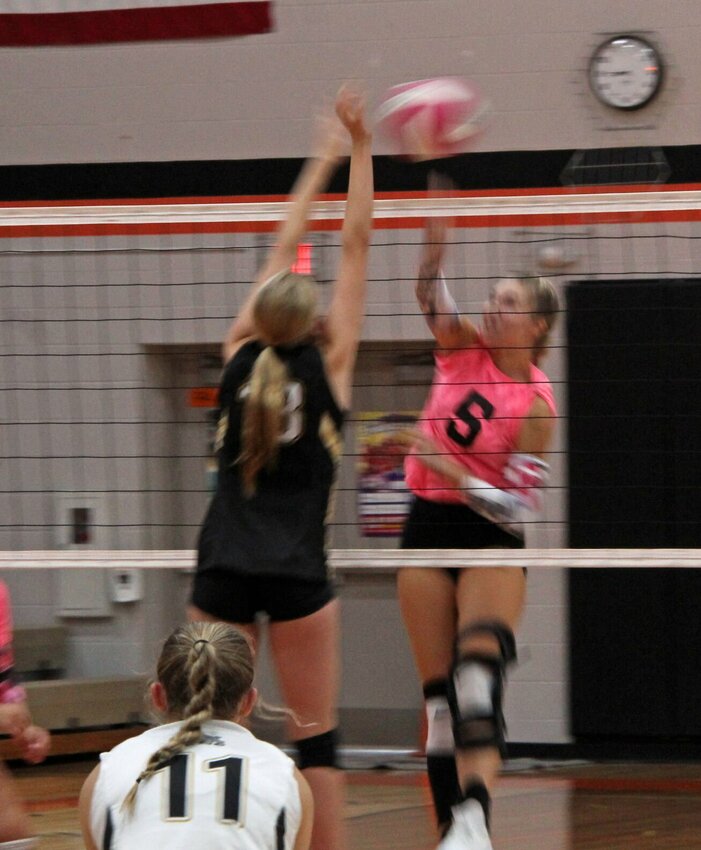 Middle hitter Kynley Gresham, junior, rises up. The Tigers defeated the Trenton Bulldogs in staight sets.