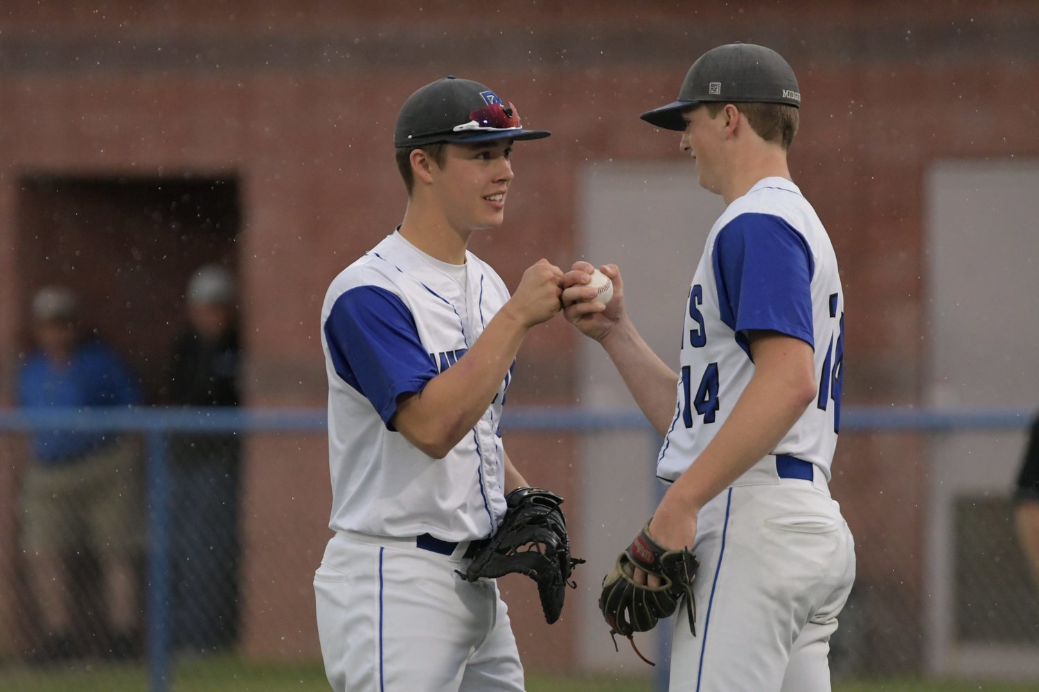 Putnam County first baseman Brayden Walter, left, and pitcher Gage Pearson fist-bump after an out during the Class 2 semifinal game against Marionville.