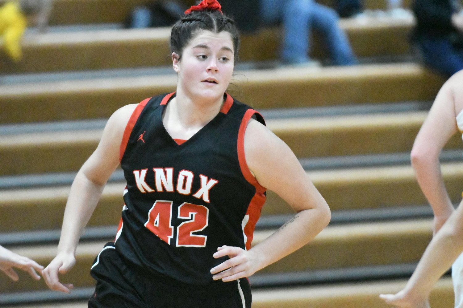 Knox County senior forward Riley Strange runs out of a screen during a game Monday against Milan during the Tri-Rivers Classic.