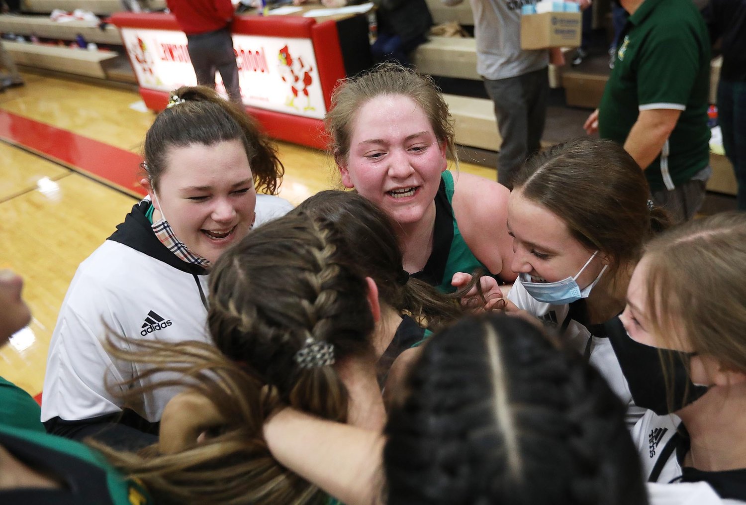 Milan reacts after defeating Lawson 54-42 Wednesday evening during Sectional Basketball at Lawson High School.