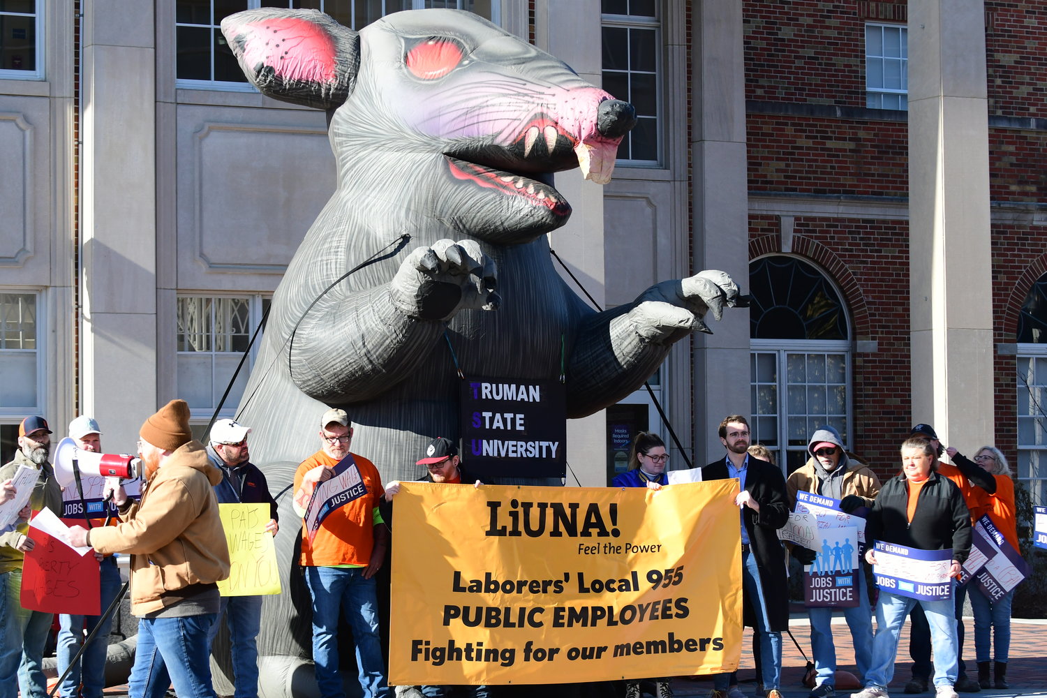 Staff members with Truman's physical plant department and LIUNA Local 955 demonstrate outside of the Student Union Building on Saturday, Dec. 4, for higher wages from the university.