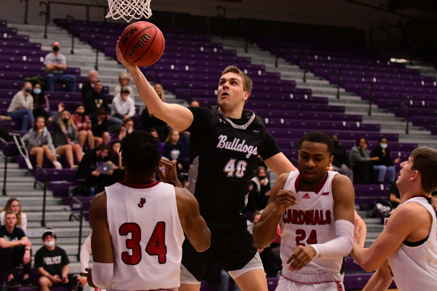 Truman's Cade McKnight goes up for a basket in a game against William Jewell.