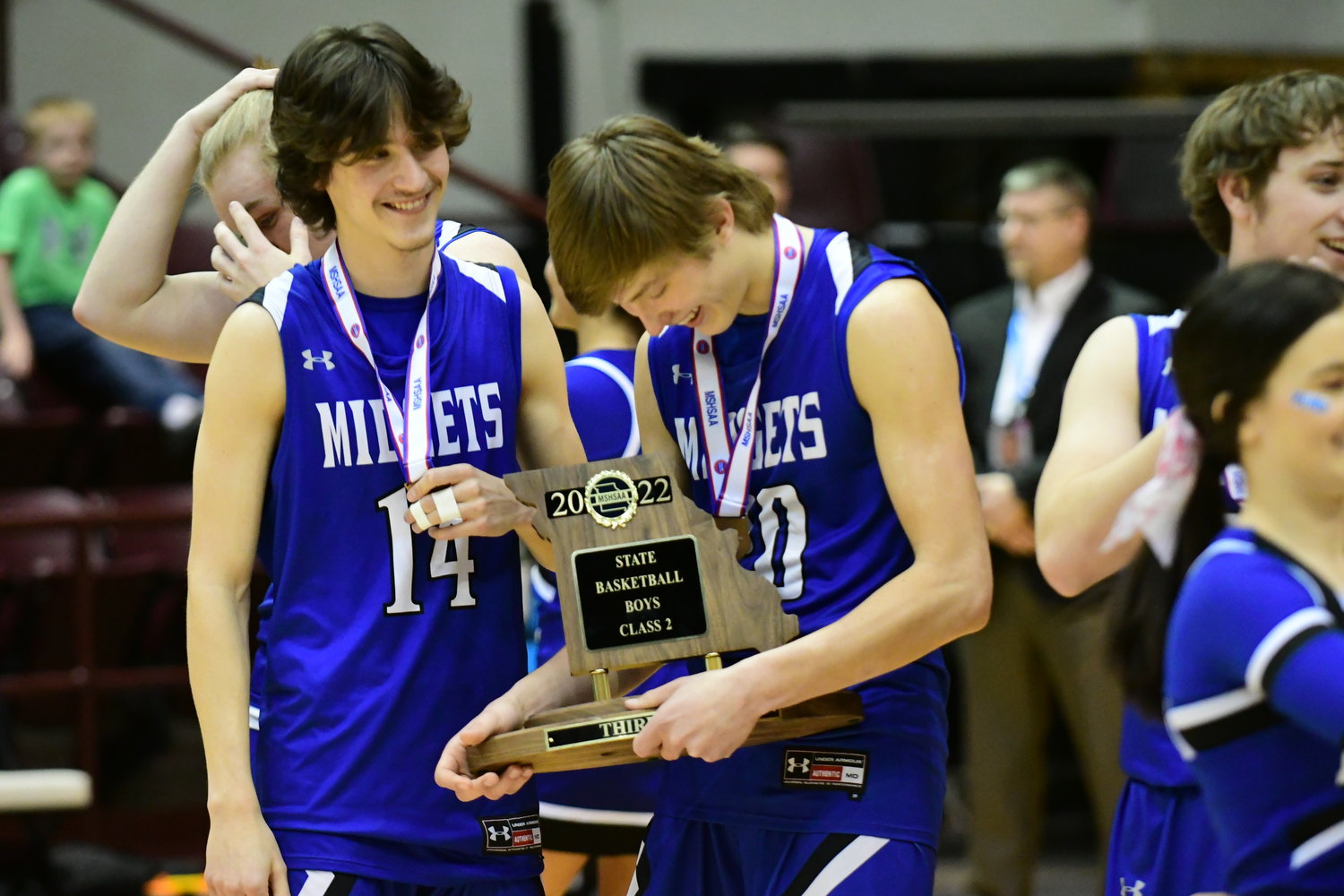 Putnam County's Trace Riediger celebrates with the team's third-place trophy after beating Bishop LeBlond 57-55 at the 2022 MSHSAA Show-Me Showdown.