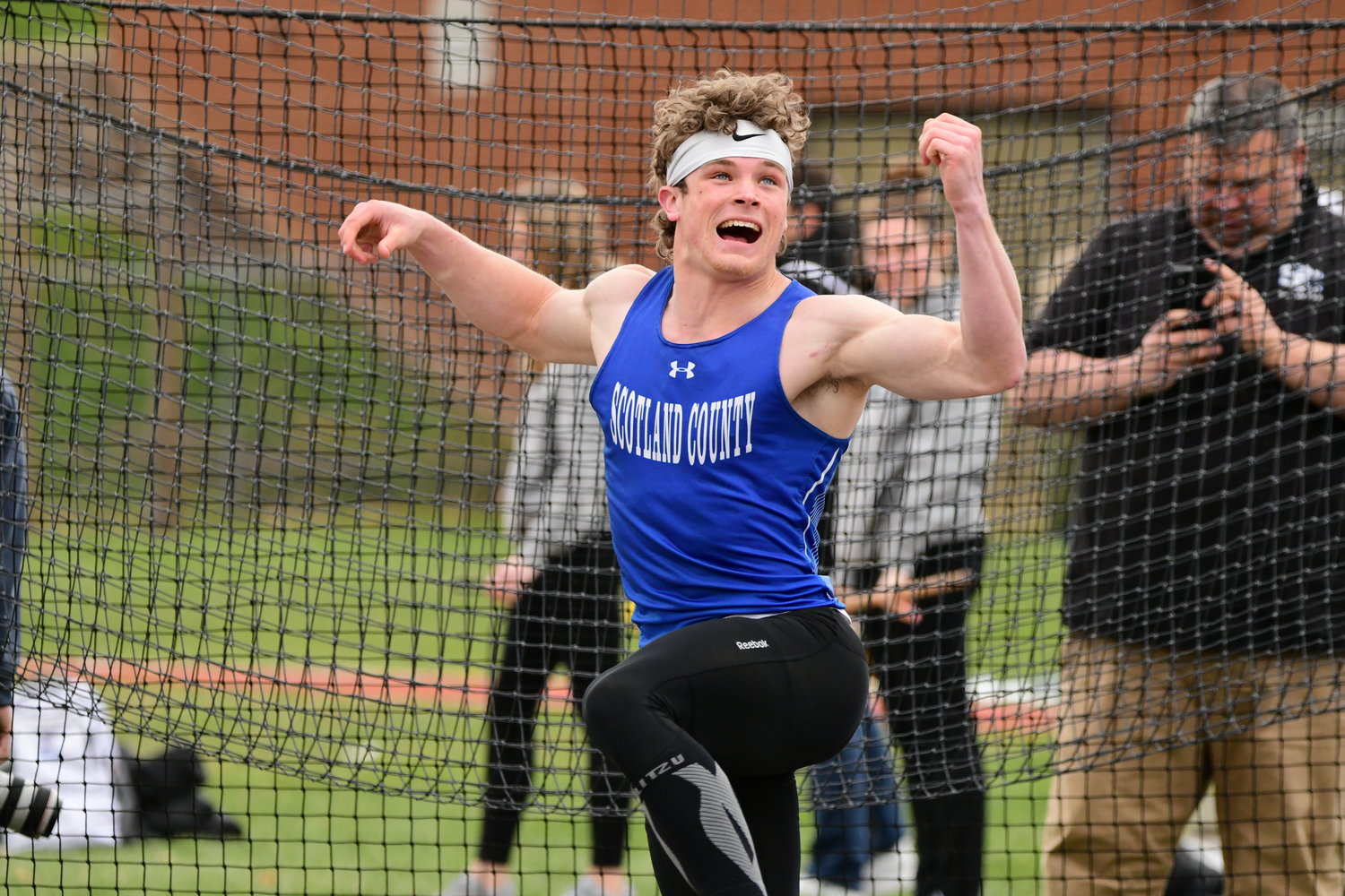 Scotland County's Hayden Long follows through on a discus throw at Tuesday's Truman State High School Invitational. He set a new meet record with a throw of 50.02 meters.