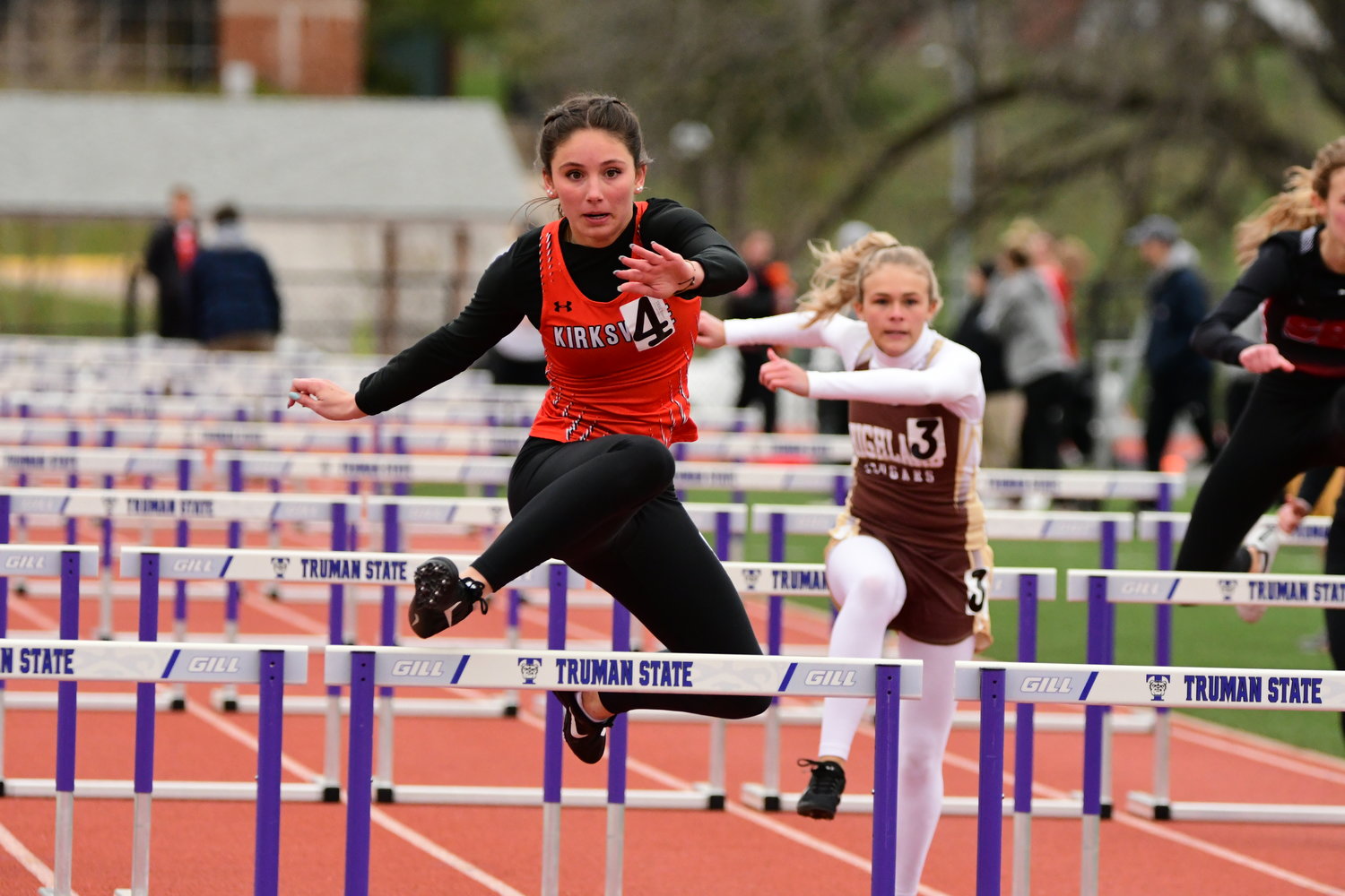 Kirksville's Jersey Herbst leads the pack in a girls 100m hurdles race at Tuesday's Truman State High School Invitational. She set a new meet record with a time of 17.18 seconds.