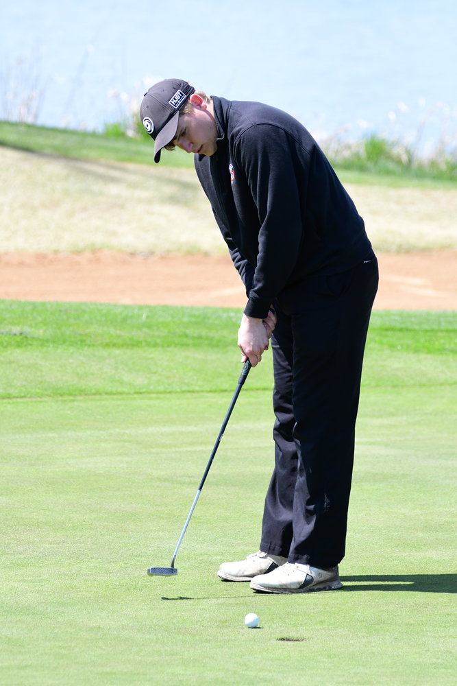 Kirksville's Johnny Boyer puts for a birdie on 18 during Tuesday's golf tournament.