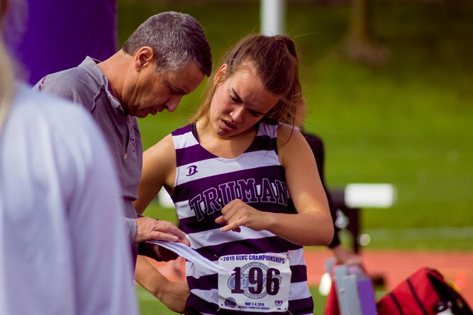 Tim Schwegler talks with Truman's Grace Feeney during the 2019 Great Lakes Valley Conference Track and Field Championships, which were hosted at Truman.