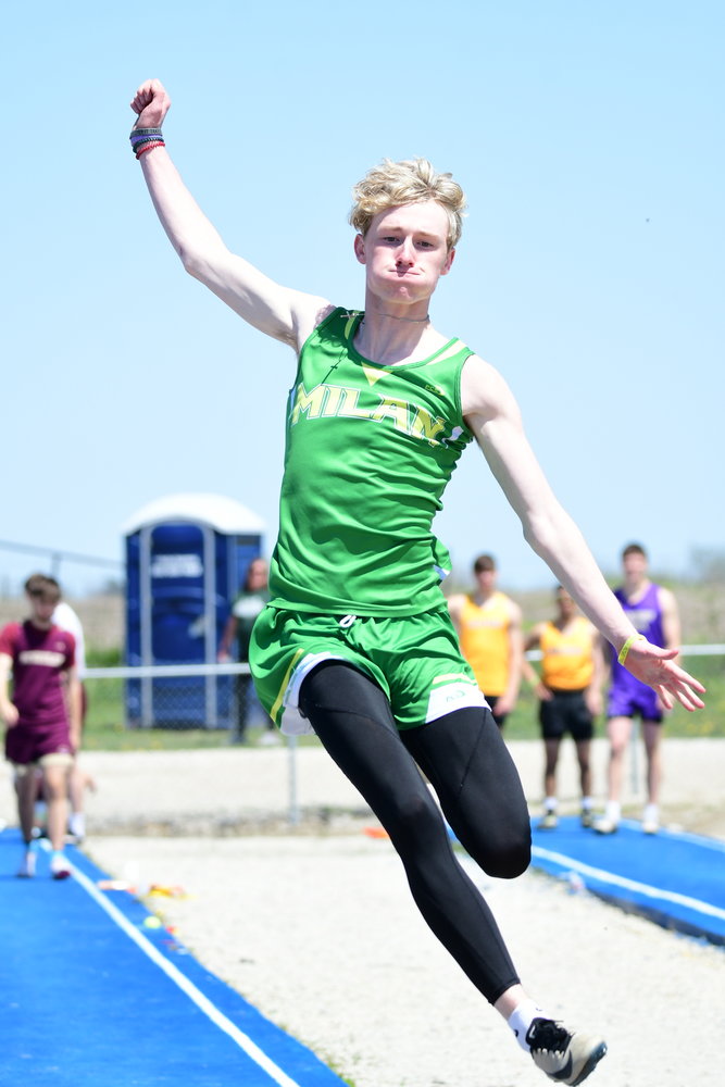 Milan's Jeremy Bennett competes in the long jump at the Class 2 District 3 track meet.