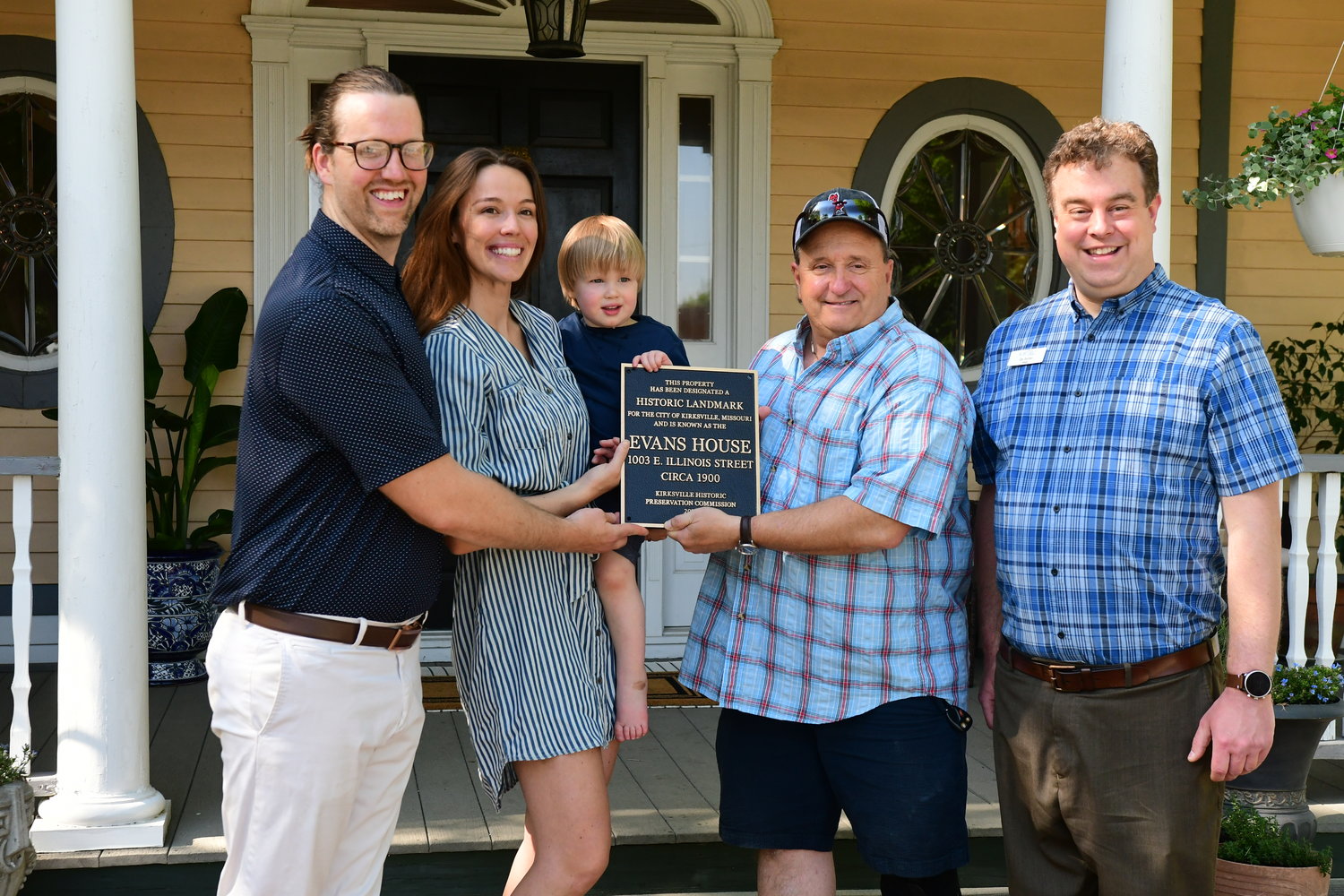 Nate, Nichelle and Otto Chastain pose alongside Bob Giovannini, chair of the Kirksville Historic Preservation Commission, and Kirksville Mayor Zac Burden. The Chastain's home at 1003 E. Illinois Street has received historic landmark by the city. The plaque was given during a ceremony on May 13, 2022.