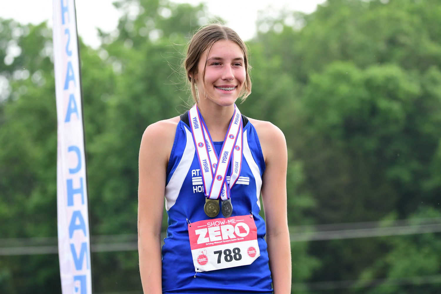 Atlanta's Kyley Magers stands on top of the podium at the 2022 MSHSAA State Track Championships after winning the Class 1 girls triple jump event on May 20, 2022.