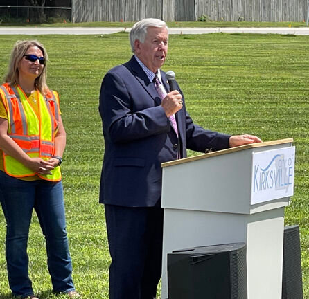 Governor Mike Parson addresses the audience on the lawn out front of Menards.