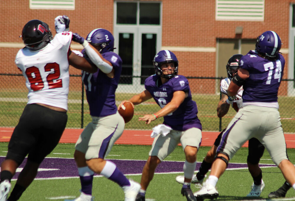 Truman State quarterback Nolan Hair steps up in the pocked while under pressure against Davenport on Sept. 3. 