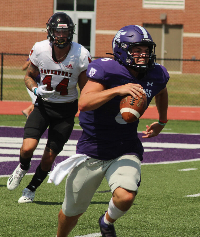 Truman State quarterback Nolan Hair scrambles away from the Davenport defense in the game on Sept. 3. 