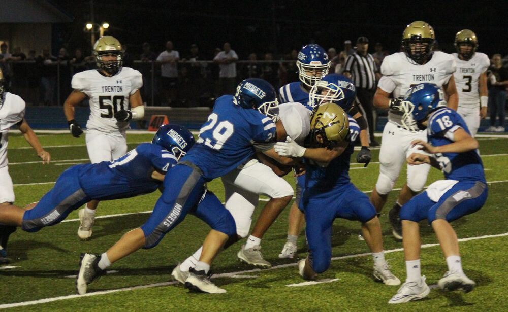 A group of Putnam County defenders bring down a Trenton ballcarrier in the game on Sept. 16. 