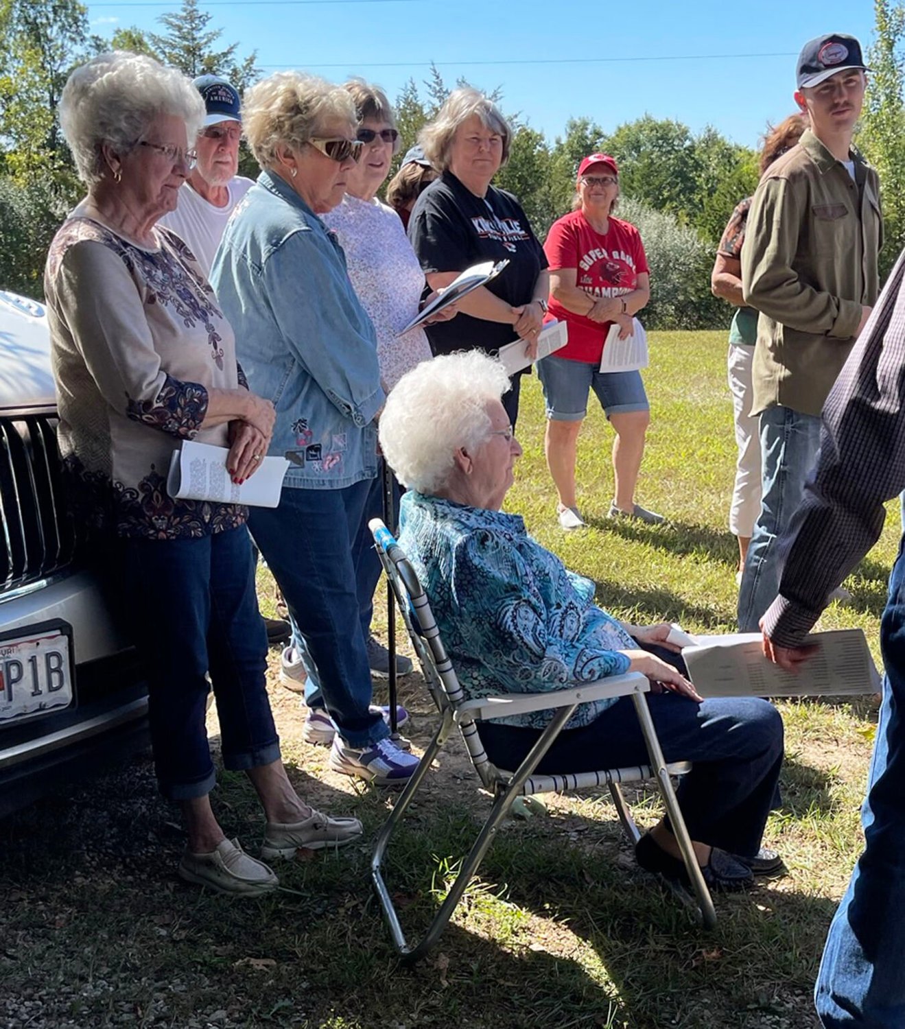 Joanne Pearce (seated) and behind her, holding paper, Pat Brawner, both of whom attended Salisbury School. The women shared stories of the school and events that took place in the area where they grew up.