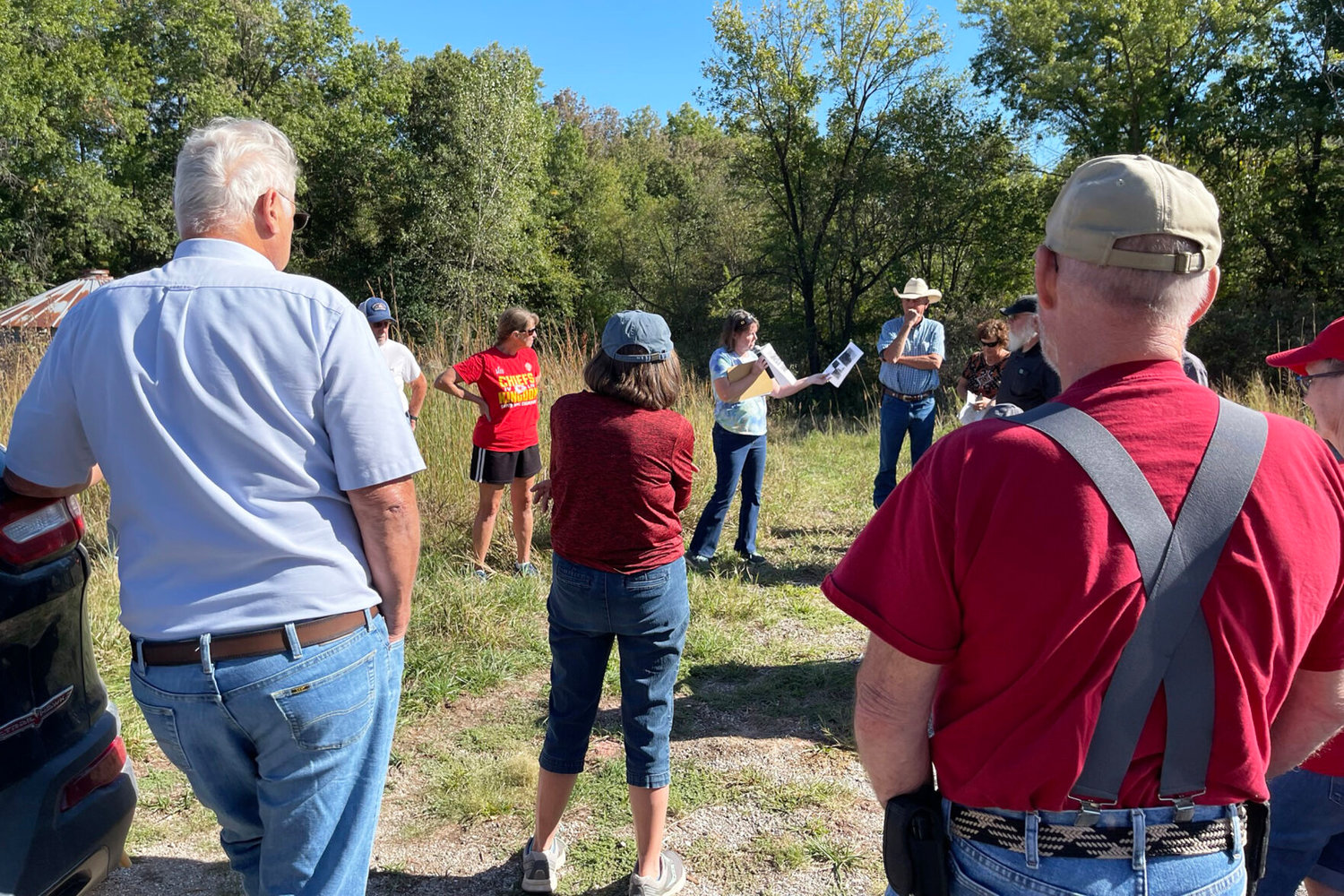 Glenna Daniels-Young speaks at the site of the Baiotto Mine #11, also known as the Simler Bluff Mine, on Hwy. 11 next to the Chariton River. The shaft was started in 1925 and was finished in 1933. The coal seam was 30 inches thick and the mine shaft was 90 feet deep, only 50 feet below the level of the river. Daniels-Young also spoke about Simlerville, the coal camp surrounding the mine, which included a store, gas station and garage.